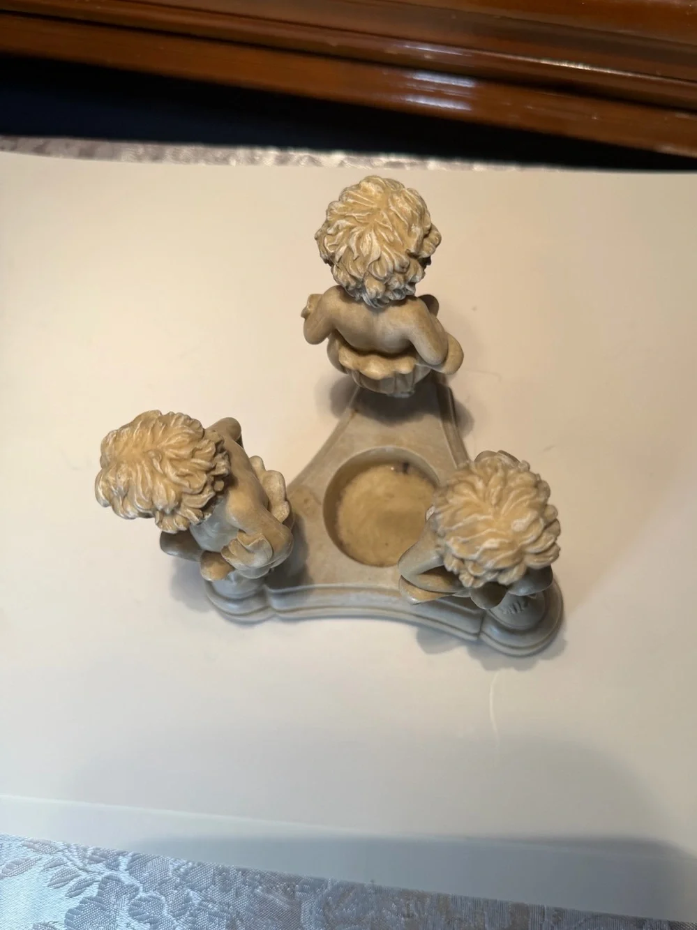 Vintage Resin Cherub Candle Holder features Three Cherubs Popping Out Of Flowers